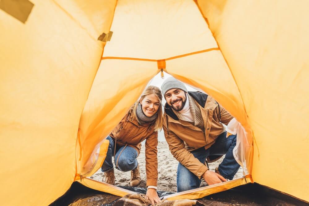 Couple looking at camping tent